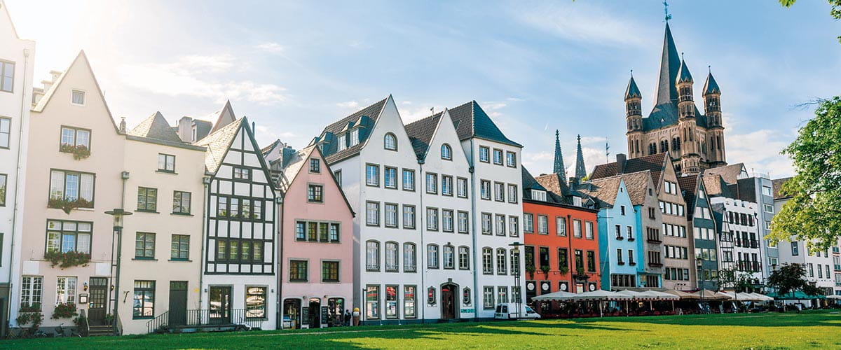 Colourful houses and St Martin's Church in Cologne, Germany